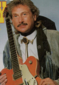 William W. de Zingende Cowboy met gitaar